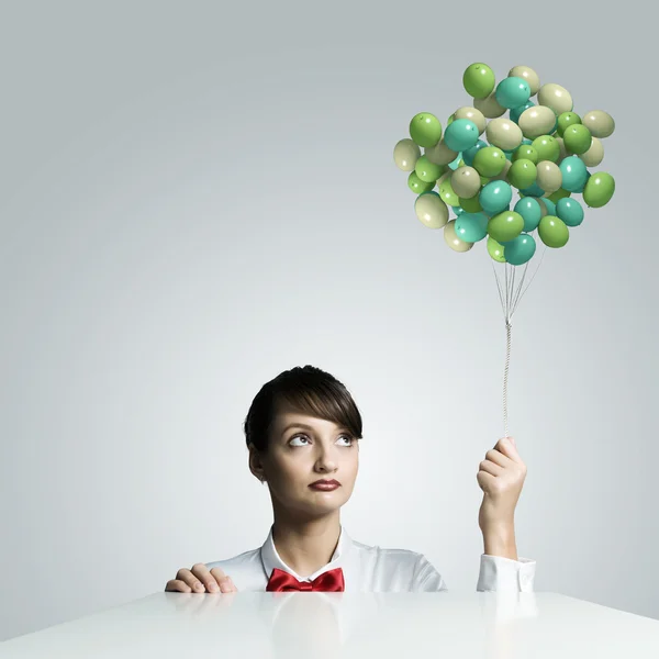 Woman with balloons — Stock Photo, Image