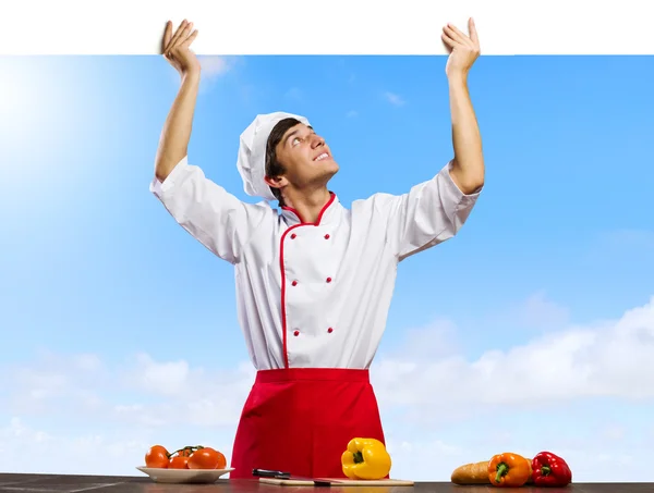Cucinare tenendo banner vuoto — Foto Stock