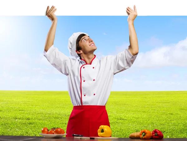 Cook holding blank banner — Stock Photo, Image