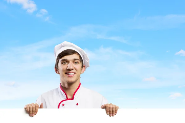 Cocinero sosteniendo bandera en blanco —  Fotos de Stock