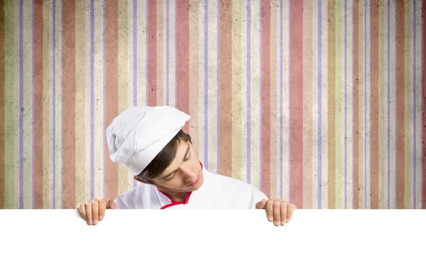 Cocinero sosteniendo bandera en blanco — Foto de Stock