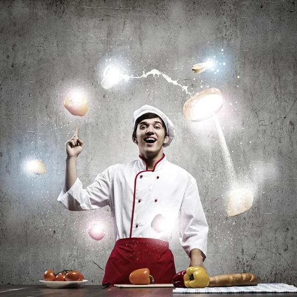 Cook and ingredients flying in air — Stock Photo, Image