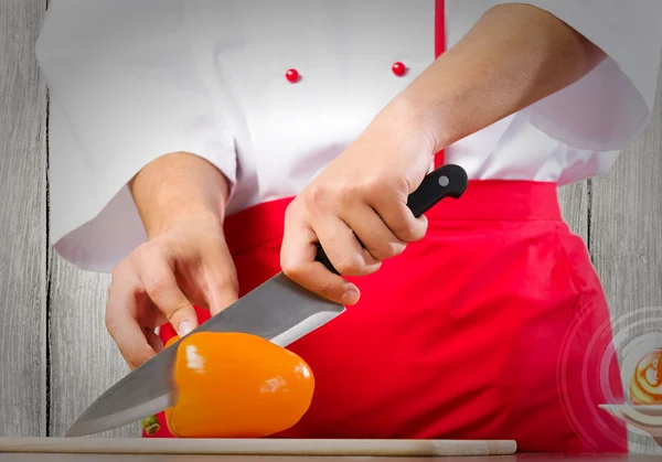 Hands cutting pepper — Stock Photo, Image