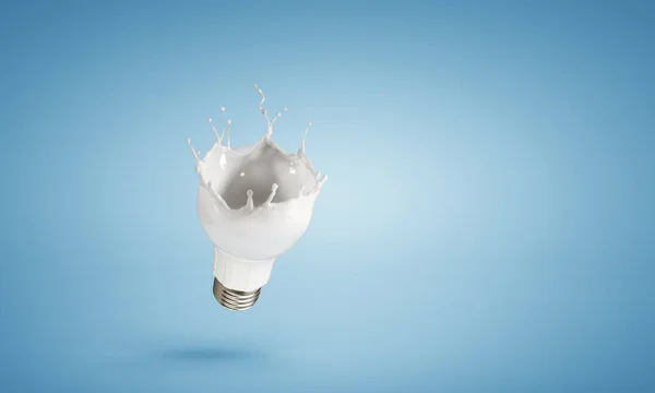 Light bulb with white glass splash — Stock Photo, Image