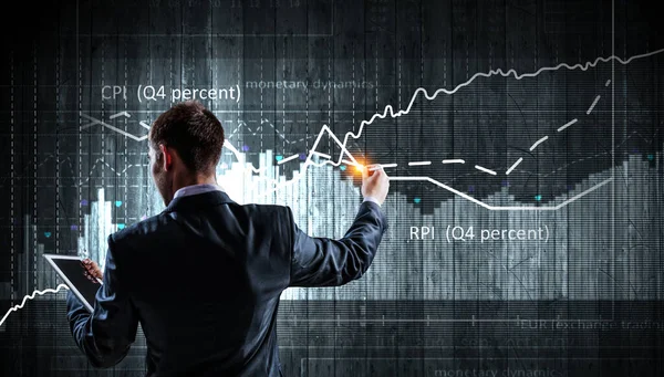 Gráfico de negócios e monitor comercial — Fotografia de Stock