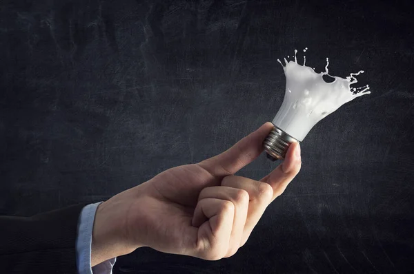 Ampoule avec éclaboussure en verre blanc — Photo