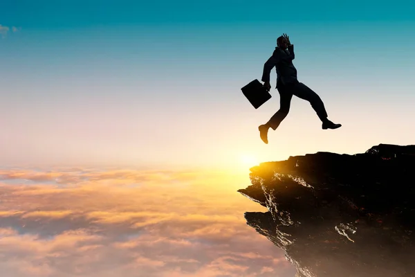 Businessman jump through the gap — Stock Photo, Image