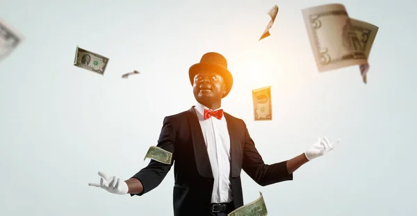 Male illusionist performing tricks . Mixed media — Stock Photo, Image