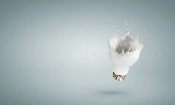 Light bulb with white glass splash — Stock Photo, Image