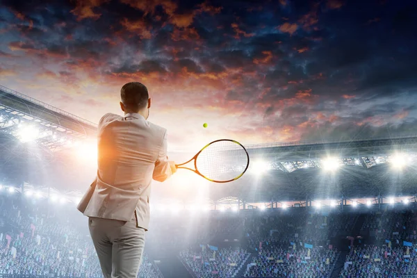 Businessman playing tennis . Mixed media — Stock Photo, Image