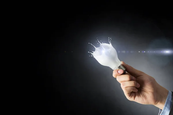 Light bulb with white glass splash — Stock Photo, Image