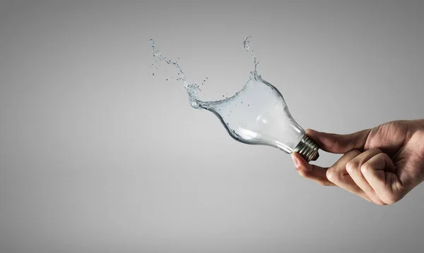 Light bulb from water splash — Stock Photo, Image