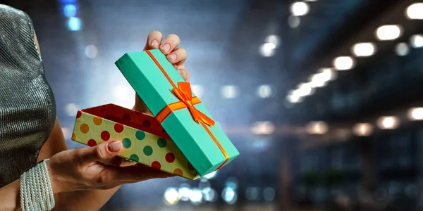 Closeup hands giving surprise gift box — Stock Photo, Image