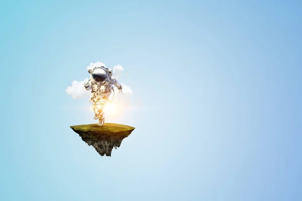 Spaceman on a light bulb — Stock Photo, Image