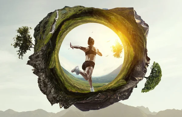 Woman running against natural landscape background — 图库照片