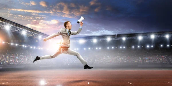 Portrait of energetic businessman jumping in open air — Stock Photo, Image