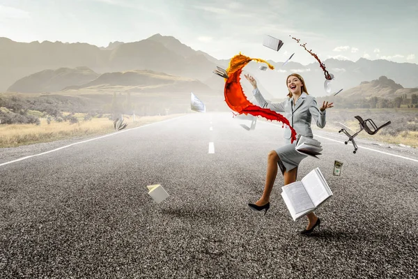 Young pretty businesswoman juggling with business items — Stock Photo, Image