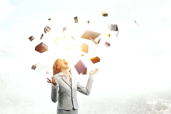 Young pretty businesswoman juggling with business items — Stock Photo, Image