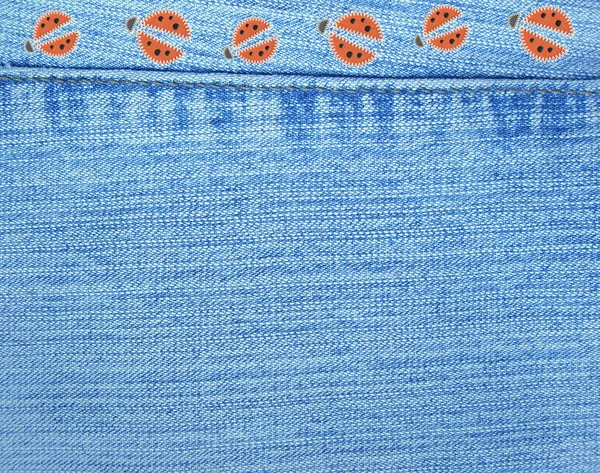 Jeans background with ladybugs — Stock Photo, Image