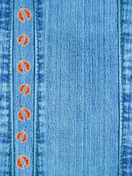 Jeans background with ladybugs — Stock Photo, Image