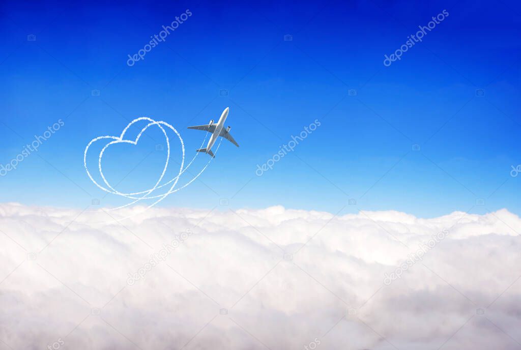 Aircraft draw a heart in the sky. Plane flies over clouds against  blue sky background. Love concept for traveling the world