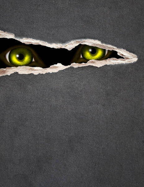 Vertical Halloween background. A look from darkness. Green eye of the monster looks through the hole in paper. Mock up template.  Copy space for text