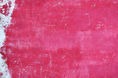 Grunge background with old stucco wall texture of magenta color. Vertical or horizontal backdrop with cracked paint texture of purple color