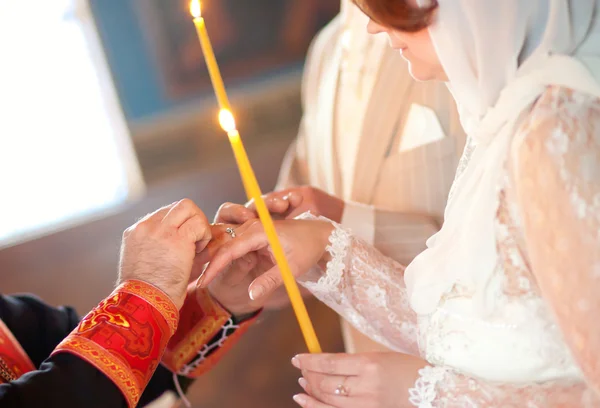 Priest is putting ring on bride — Stock Photo, Image