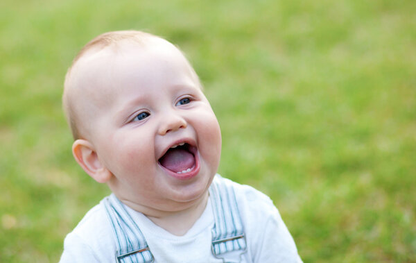 Happy adorable little boy outdoors