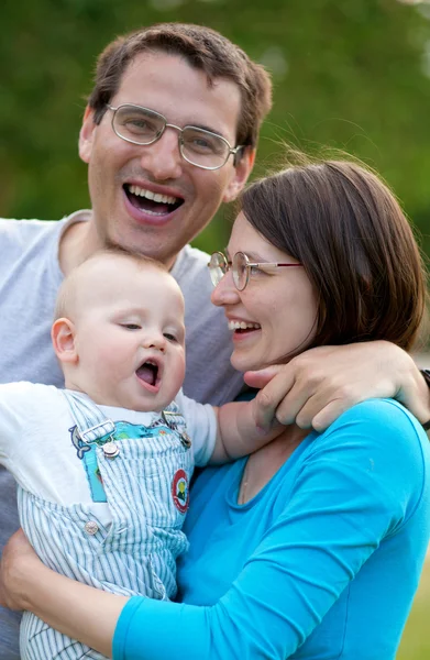 Happy family of three having fun together — Stock Photo, Image