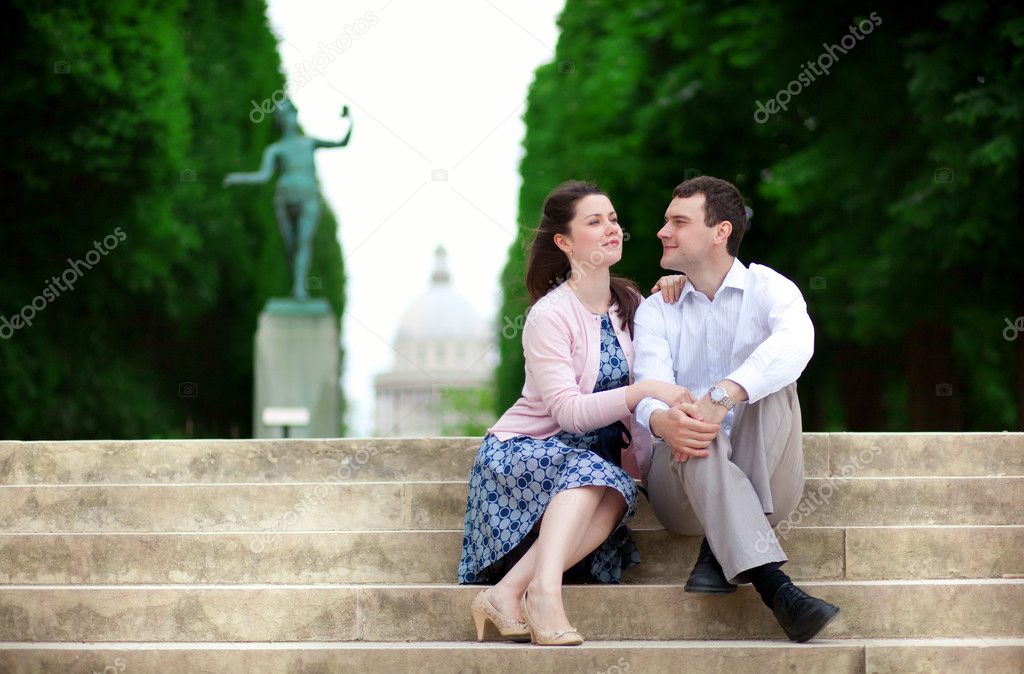 Couple sitting on the stairs in park