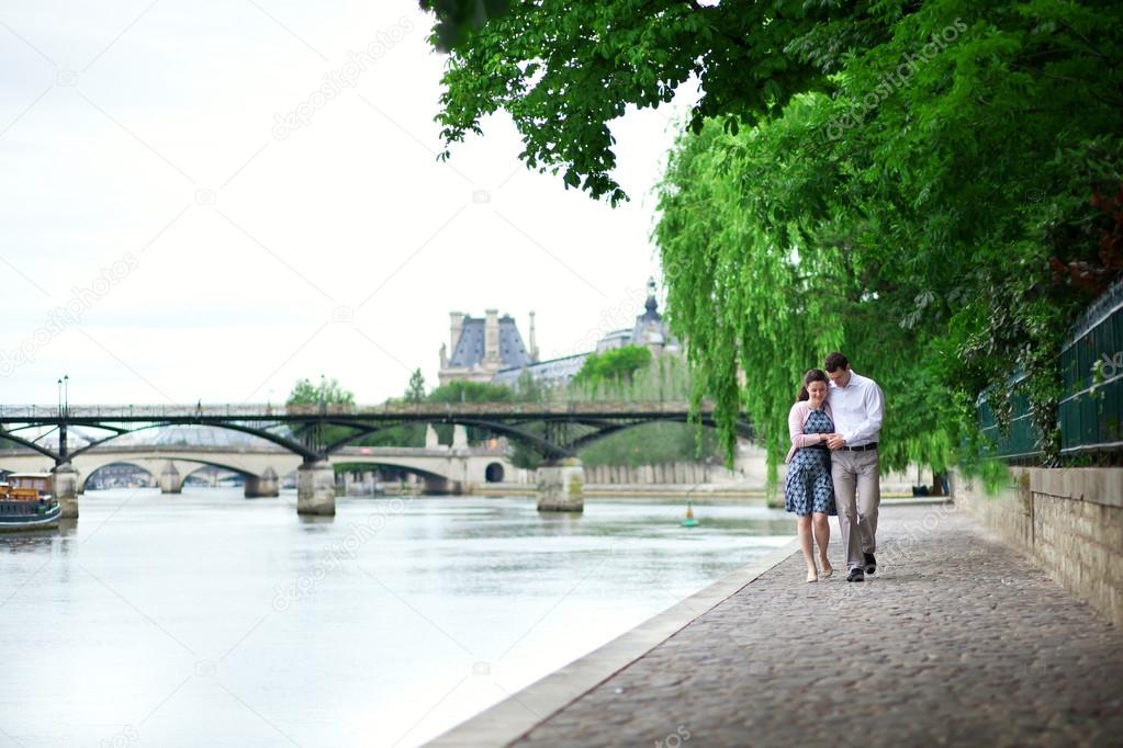 Romantic dating couple is walking by the water