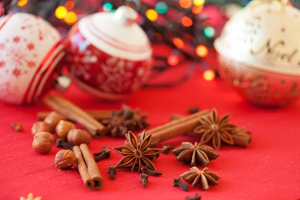 Closeup of spices and Christmas decorations in the background — Stock Photo, Image