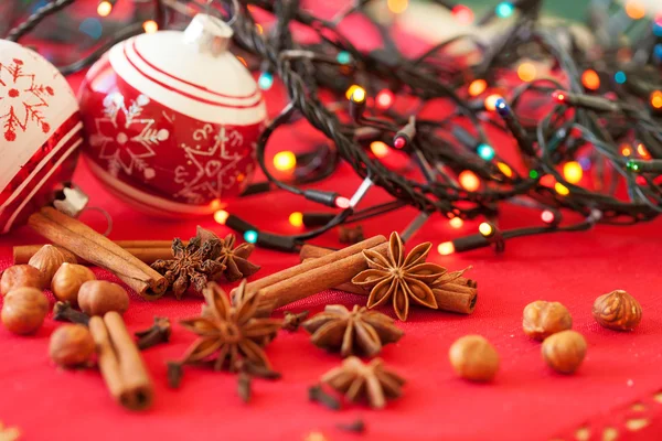 Closeup of spices and Christmas decorations in the background — Stock Photo, Image