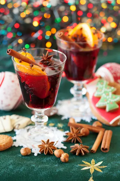 Two glasses of mulled wine, cookies and variation of Christmas s Royalty Free Stock Images