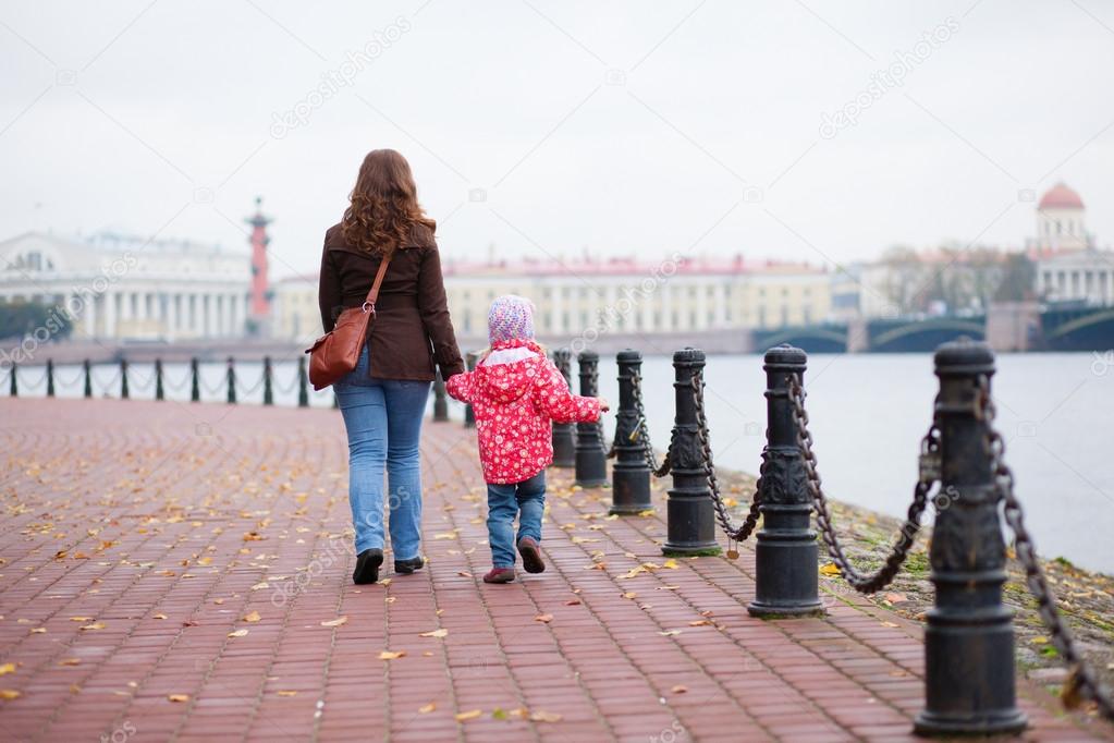 Mother and daughter walking in the center of Saint-Petersburg, R