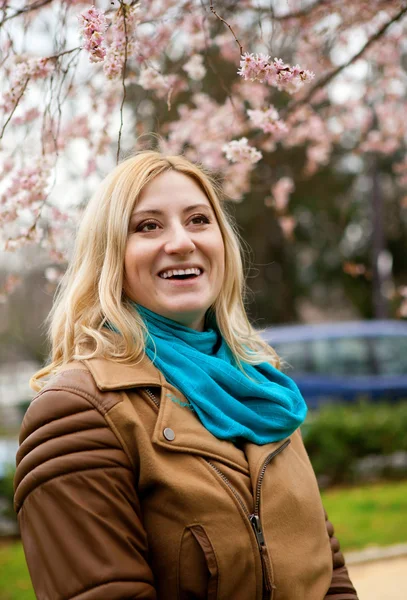 Beautiful blonde woman at spring, with cherry tree — Stock Photo, Image