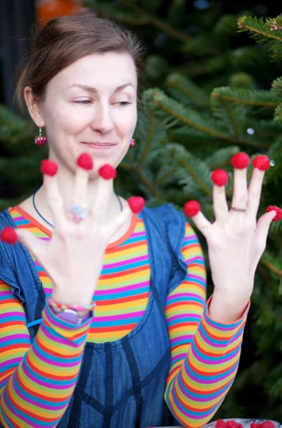 Beautiful young girl in bright clothes poses as Amelie with rasp — Stock Photo, Image