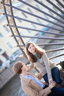 Young couple near the entrance to Summer garden in Saint-Petersb