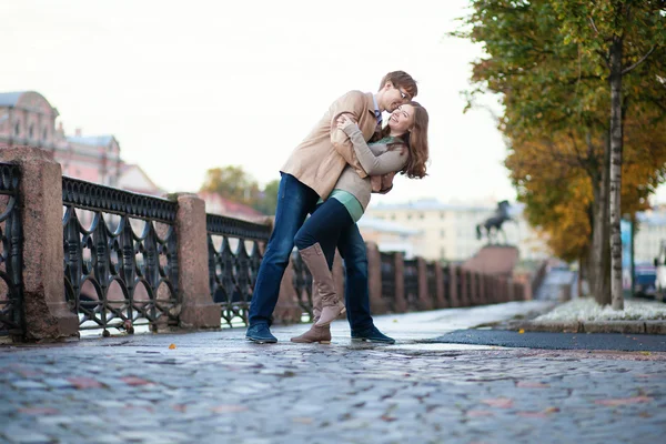 Romantic couple hugging on a street — Stock Photo, Image