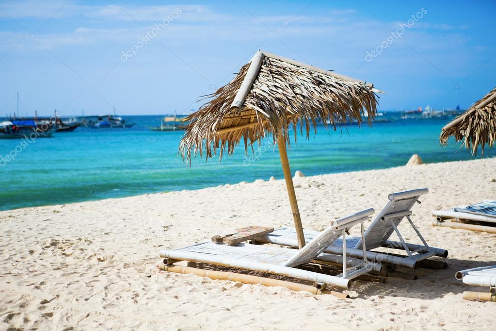 Deckchairs at the perfect white sand beach on Boracay, Philippines