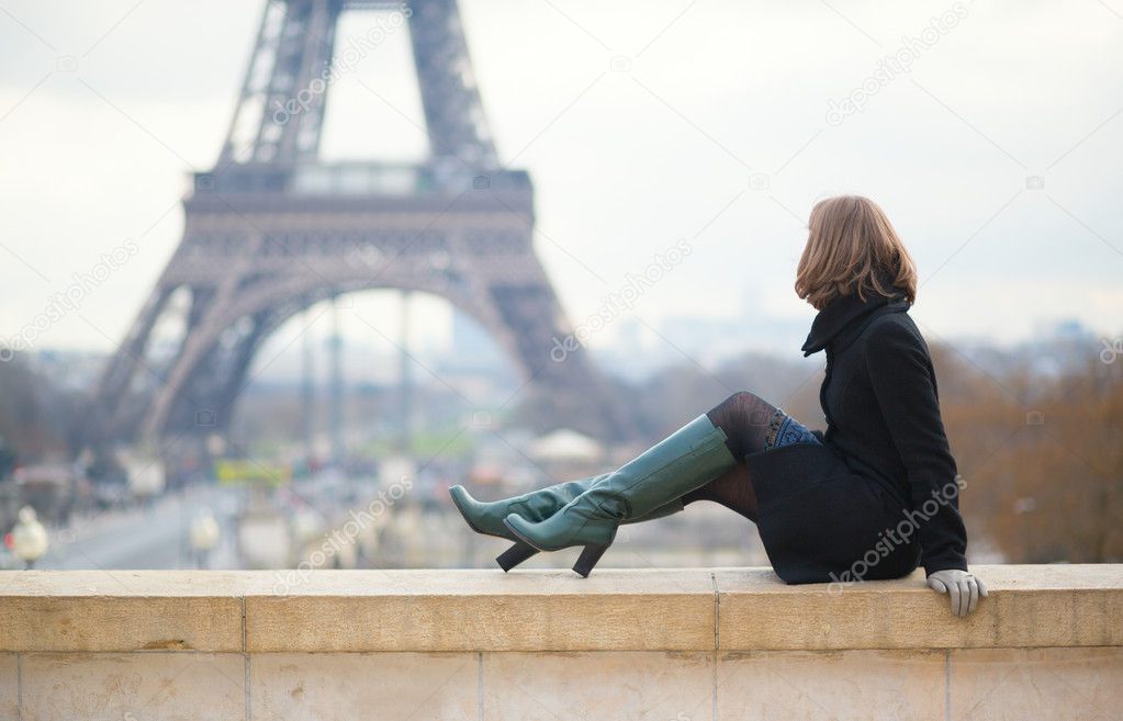 Woman looking at the Eiffel tower