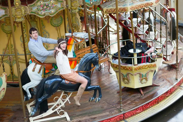 Couple on a traditional Parisian merry-go-round — Stock Photo, Image