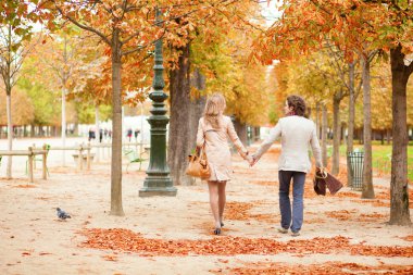 Beautiful loving couple on a fall day clipart