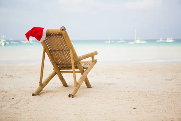 Santa hat on chaise longue — Stock Photo, Image