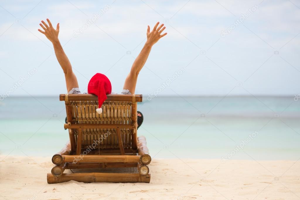 Santa sitting on chaise longue