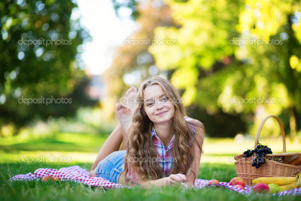 Young girl having a picnic Stock Photo by ©encrier 32362103