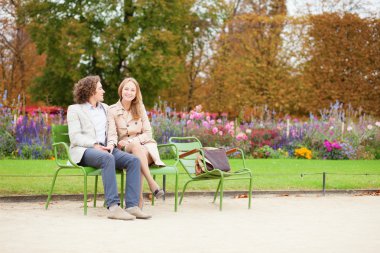 Happy couple in the Tuileries garden of Paris clipart