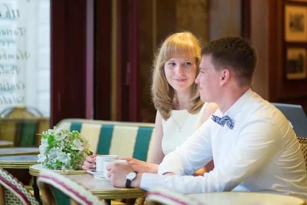 Just married couple drinking coffee in a cafe — Stock Photo, Image