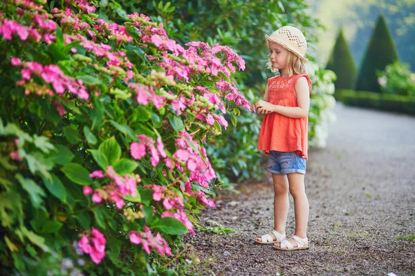 Adorable Toddler Girl Enjoying Rosehip Flowers Summer Park Happy Kid — Stock Photo, Image